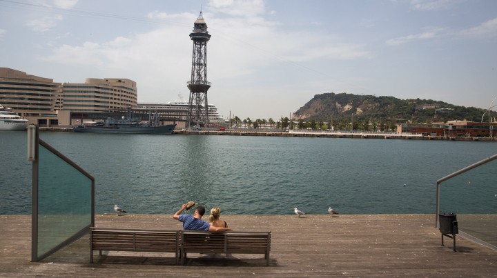 Tourists enjoy at the Barcelona Port promenade in Central Barcelona, Spain, on July 3, 2015. (Nati Shohat/Flash90)