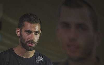 Aviram Shaul, the brother of fallen soldier Oron Shaul, speaks at a rally marking two years since his sibling's body was seized by Hamas, at a protest tent outside Prime Minister Benjamin Netanyahu's residence in Jerusalem,  July 20, 2016. (Hadas Parush/Flash90)