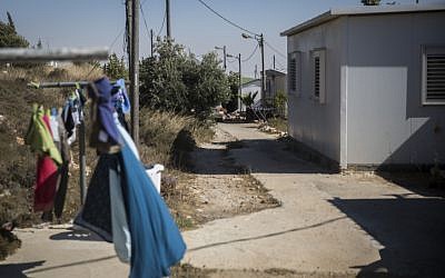 View of a street and caravan homes at the Amona outpost in the West Bank, on July 28, 2016. (Hadas Parush/FLASH90) View of a street and caravan homes at the Amona outpost in the West Bank, on July 28, 2016. (Hadas Parush/FLASH90)
