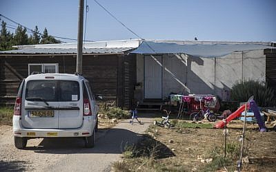 View of a street and caravan homes at the Amona Jewish outpost in the West Bank, on July 28, 2016. (Hadas Parush/FLASH90) View of a street and caravan homes at the Amona Jewish outpost in the West Bank, on July 28, 2016. (Hadas Parush/FLASH90)