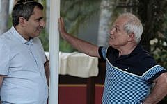 Jerusalem Minister Zeev Elkin (L) speaks with Welfare Minister Haim Katz outside a meeting of the Likud secretariat in Maccabiah Village, near Tel Aviv on August 16, 2016. (Tomer Neuberg/Flash90)
