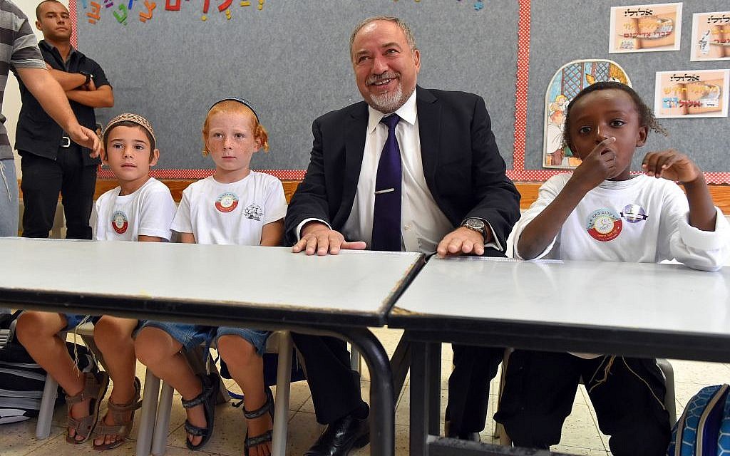 Defense Minister Avigdor Liberman sits with students on the first day of the school year in Har Hebron on September 1, 2016. (Photo by Ariel Hermoni/Defense Ministry) Defense Minister Avigdor Liberman sits with students on the first day of the school year in Har Hebron on September 1, 2016. (Photo by Ariel Hermoni/Defense Ministry)