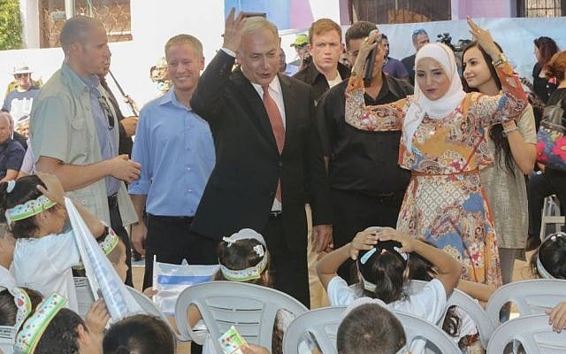 Prime Minister Benjamin Netanyahu welcomes new first grade students at the start of the school year in the Arab city of Tamra, on September 1, 2016. Photo by Flash90) 