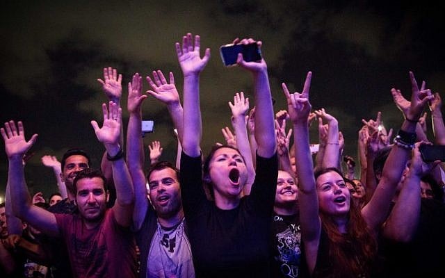 Fans cheer during a concert of American singer Adam Lambert and British band Queen in Hayarkon Park, Tel Aviv, September 12, 2016. (Miriam Alster/Flash90)