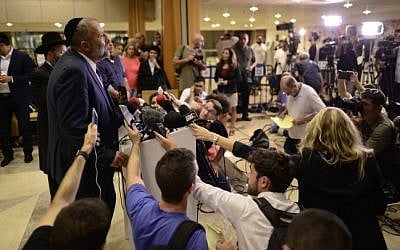 Shas leader and Economy Minister Aryeh Deri speaks with media at the Sheba Medical Center after visiting Shimon Peres on September 27, 2016. Tomer Neuberg/Flash90)