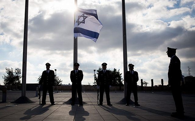 The Knesset honor guard lowers the Israeli flag to half-mast during a ceremony in memory of Shimon Peres on September 28, 2016. (Hadas Parushl/Flash90) The Knesset honor guard lowers the Israeli flag to half-mast during a ceremony in memory of Shimon Peres on September 28, 2016. (Hadas Parushl/Flash90)