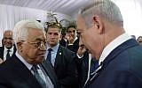 Prime Minister Benjamin Netanyahu meets with Palestinian Authority President Mahmoud Abbas during the state funeral of late president Shimon Peres, held at Mount Herzl in Jerusalem on September 30, 2016. (Amos Ben Gershom/GPO)