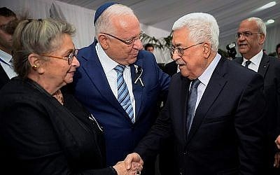 President Reuven Rivlin and his wife Nechama meet Palestinian Authority President Mahmoud Abbas during the State funeral for late former President Shimo Peres at Mount Herzl Cemetery in Jerusalem, on September 30, 2016. (Mark Neyman/GPO)