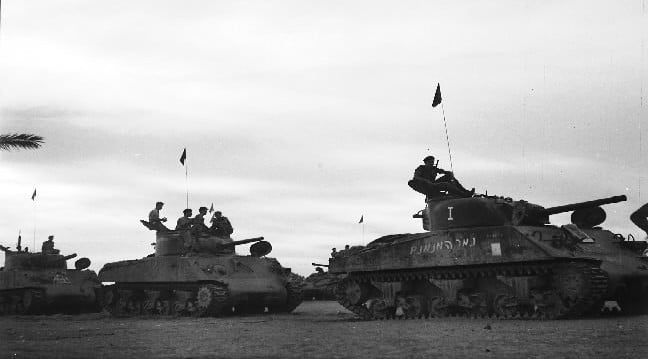 Israeli Sherman tanks advance toward the Mitla Pass during the 1956 Sinai Campaign. (Israel Defense Forces/Flickr)