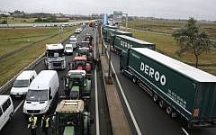 Truckers and farmers block the highway near Calais, northern France, Monday Sept. 5, 2016.  (AP/Thibault Camus)