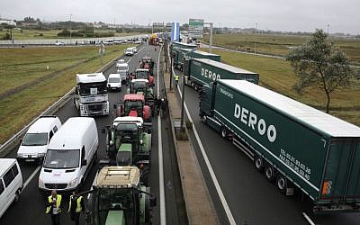 Truckers and farmers block the highway near Calais, northern France, Monday Sept. 5, 2016.  (AP/Thibault Camus)