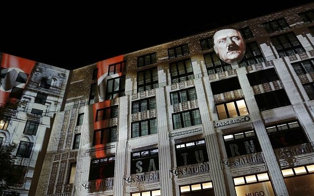 The face of Adolf Hitler is projected onto a 3D canvas as part of an art installation during a rehearsal for the "Berlin Leuchtet" ("Berlin shines") festival in Berlin, Germany, Thursday, Sept. 29, 2016. (AP Photo/Michael Sohn)