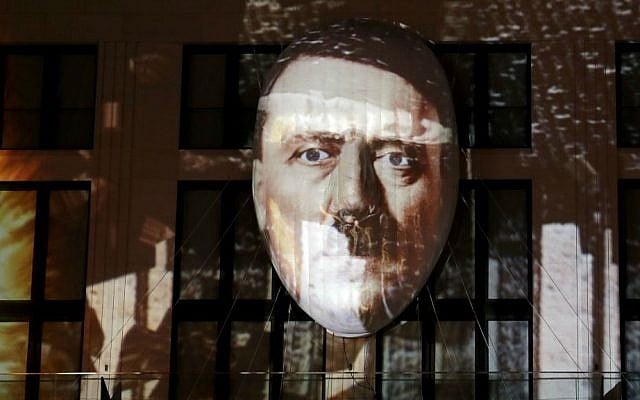 The face of Adolf Hitler is projected onto a 3D canvas as part of an art installation during a rehearsal for the "Berlin Leuchtet" ("Berlin shines") festival in Berlin, Germany, Thursday, Sept. 29, 2016. (AP Photo/Michael Sohn)