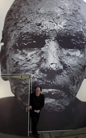 A man walks through a door covered by a giant photo, titled 'Golem', by photographer Joachim Seinfeld during a press presentation for the 'Golem' exhibition at the Jewish Museum in Berlin, Germany, Thursday, Sept. 22, 2016. (AP Photo/Michael Sohn) A man walks through a door covered by a giant photo, titled 'Golem', by photographer Joachim Seinfeld during a press presentation for the 'Golem' exhibition at the Jewish Museum in Berlin, Germany, Thursday, Sept. 22, 2016. (AP Photo/Michael Sohn)