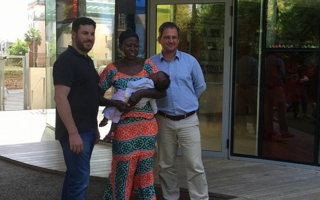 Paul Charney (left) with house mother Isatou Sillah, who is holding child patient Sanusay Demba at Wolfson Hospital in Tel Aviv. (Courtesy) Paul Charney (left) with house mother Isatou Sillah, who is holding child patient Sanusay Demba at Wolfson Hospital in Tel Aviv. (Courtesy)