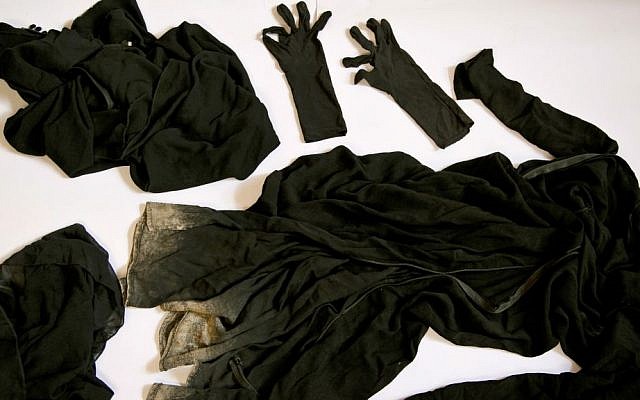 Clothing worn by a Yazidi girl enslaved by Islamic State militants, collected by a Yazidi activist to document Islamic State group crimes against the community, shown in this file photo taken May 22, 2016, in Dohuk, northern Iraq. (AP Photo/Maya Alleruzzo, File)