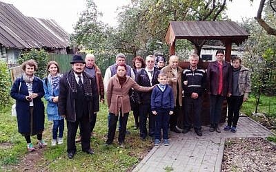 Residents of Vishnyeva gather outside Shimon Peres’s childhood home to pay their respects on the day of his death, September 28, 2016. (Courtesy of Limmud FSU)