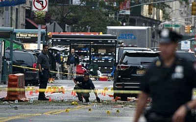 Crime scene investigators work Sunday, Sept. 18, 2016, at the scene of Saturday's explosion in Manhattan's Chelsea neighborhood, in New York. (AP Photo/Craig Ruttle) Crime scene investigators work Sunday, Sept. 18, 2016, at the scene of Saturday's explosion in Manhattan's Chelsea neighborhood, in New York. (AP Photo/Craig Ruttle)