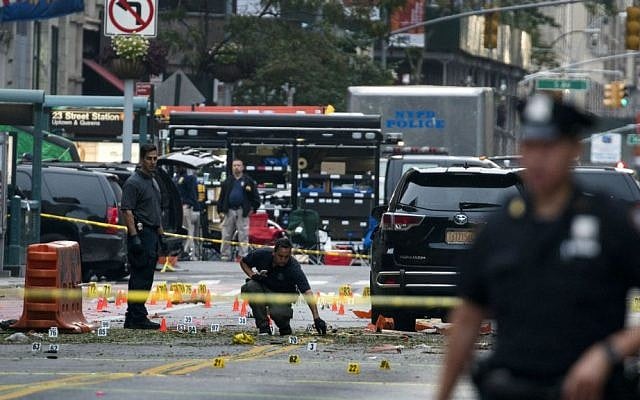 Crime scene investigators work Sunday, Sept. 18, 2016, at the scene of Saturday's explosion in Manhattan's Chelsea neighborhood, in New York. (AP Photo/Craig Ruttle)
