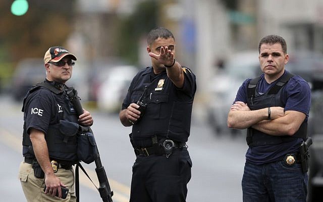 Police officers stand on Elizabeth Ave., in Linden, N.J., near where an Afghan immigrant wanted for questioning in the bombings that rocked a New York City neighborhood and a New Jersey shore town was taken into custody September 19, 2016. (AP/Mel Evans)