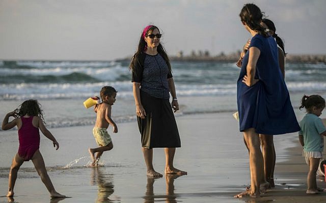 In this photo made on Thursday, Sep. 1, 2016, an Israeli Jewish woman wears a modest swimsuit on the beach near the port city of Ashdod, Israel. (AP Photo/Tsafrir Abayov) In this photo made on Thursday, Sep. 1, 2016, an Israeli Jewish woman wears a modest swimsuit on the beach near the port city of Ashdod, Israel. (AP Photo/Tsafrir Abayov)