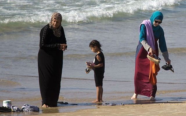 In this Friday, Sept. 2, 2016 photo, Muslim women stand at a beach in Tel Aviv, Israel. (AP Photo/Ariel Schalit) In this Friday, Sept. 2, 2016 photo, Muslim women stand at a beach in Tel Aviv, Israel. (AP Photo/Ariel Schalit)