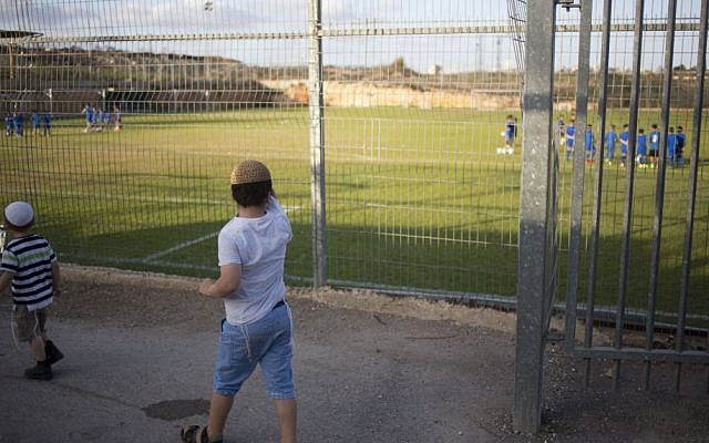 Children watch a soccer training session in the West Bank settlement of Givat Ze'ev, near Jerusalem, Sept. 22, 2016 (AP Photo/Ariel Schalit) Children watch a soccer training session in the West Bank settlement of Givat Ze'ev, near Jerusalem, Sept. 22, 2016 (AP Photo/Ariel Schalit)