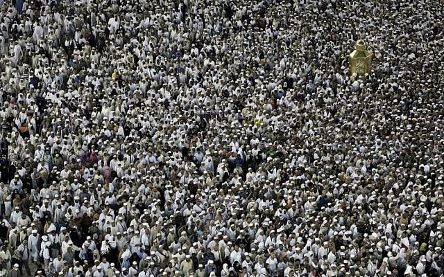 In this Wednesday, Sept. 7, 2016 file photo, Muslim pilgrims circle the Kaaba and try to touch Maqam Ibrahim or The Station of Abraham, the golden glass structure at top right, at the Grand Mosque in the Muslim holy city of Mecca, Saudi Arabia. (AP Photo/Nariman El-Mofty, File)