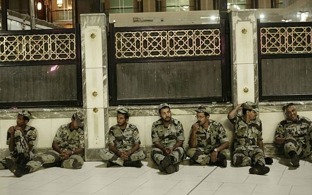 Saudi soldiers rest before praying the Fajr, prayer before sunrise, outside the Grand Mosque in the Muslim holy city of Mecca, Saudi Arabia, September 8, 2016. (AP Photo/Nariman El-Mofty)