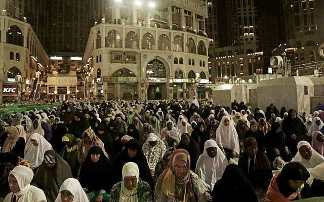 Muslim pilgrims pray the Fajr prayer before sunrise, outside the Grand Mosque in the Muslim holy city of Mecca, Saudi Arabia, Thursday, Sept. 8, 2016. (AP Photo/Nariman El-Mofty)