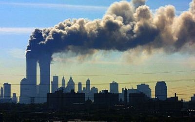 In this Sept. 11, 2001 file photo, as seen from the New Jersey Turnpike near Kearny, New Jersey, smoke billows from the twin towers of the World Trade Center in New York after airplanes flown by Al-Qaeda terrorists crashed into both towers. (AP Photo/Gene Boyars, File) In this Sept. 11, 2001 file photo, as seen from the New Jersey Turnpike near Kearny, New Jersey, smoke billows from the twin towers of the World Trade Center in New York after airplanes flown by Al-Qaeda terrorists crashed into both towers. (AP Photo/Gene Boyars, File)