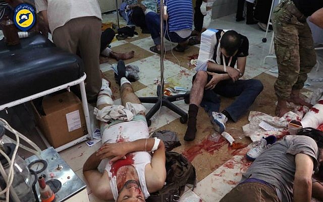 Wounded men receiving treatment at a local clinic after airstrikes hit in Aleppo, Syria, September 24, 2016. (Syrian Civil Defense White Helmets via AP) 