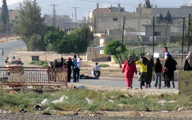 This photo provided by the Syria Press Center (SPC), an anti-government media group, shows civilians leaving the town of Suran, in Hama province, Syria, Thursday Sept. 1, 2016. (Syria Press Center via AP) This photo provided by the Syria Press Center (SPC), an anti-government media group, shows civilians leaving the town of Suran, in Hama province, Syria, Thursday Sept. 1, 2016. (Syria Press Center via AP)