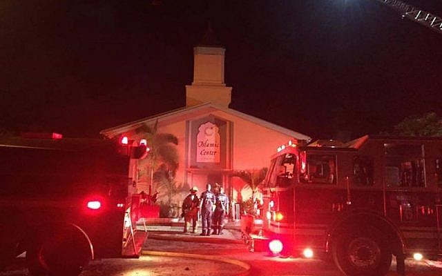 Firefighters work at the scene of a fire at the Islamic Center of Fort Pierce on Monday, September 12, 2016, in Fort Pierce, Florida (St. Lucie Sheriff's Office via AP) Firefighters work at the scene of a fire at the Islamic Center of Fort Pierce on Monday, September 12, 2016, in Fort Pierce, Florida (St. Lucie Sheriff's Office via AP)