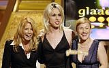 In this April 8, 2006 file photo, acting siblings Rosanna Arquette, from left, Alexis Arquette, center, and Patricia Arquette present an award at the 17th annual Gay and Lesbian Alliance Against Defamation Media Awards in Los Angeles. (AP Photo/Chris Pizzello, File)