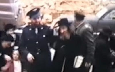 Rabbi Shear Yashuv Cohen (left) on his wedding day accompanied by his father David Cohen, known as 'the Nazir' (Screen capture: YouTube)