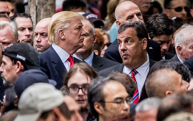 Republican presidential candidate Donald Trump, left, speaks with New Jersey Gov. Chris Christie, right, as he attends a ceremony at the Sept. 11 memorial, in New York, Sunday, Sept. 11, 2016, on the 15th anniversary of the Sept. 11 attacks. (AP Photo/Andrew Harnik)