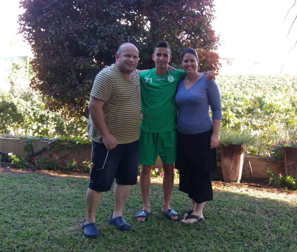 Shachar, a 16.5-year-old raising star in Kfar Saba's highest youth league, is flanked by his very supportive parents. (Facebook) Shachar, a 16.5-year-old raising star in Kfar Saba's highest youth league, is flanked by his very supportive parents. (Facebook)