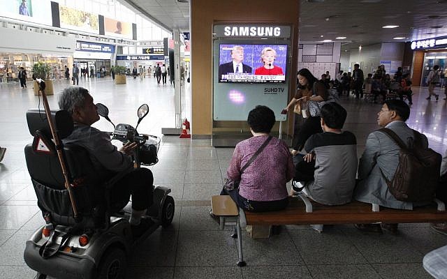 People watch a TV screen showing the live broadcast of the US presidential debate between Democratic presidential nominee Hillary Clinton and Republican presidential nominee Donald Trump, at Seoul Railway Station in Seoul, South Korea, September 27, 2016. (AP Photo/Ahn Young-joon) People watch a TV screen showing the live broadcast of the US presidential debate between Democratic presidential nominee Hillary Clinton and Republican presidential nominee Donald Trump, at Seoul Railway Station in Seoul, South Korea, September 27, 2016. (AP Photo/Ahn Young-joon)