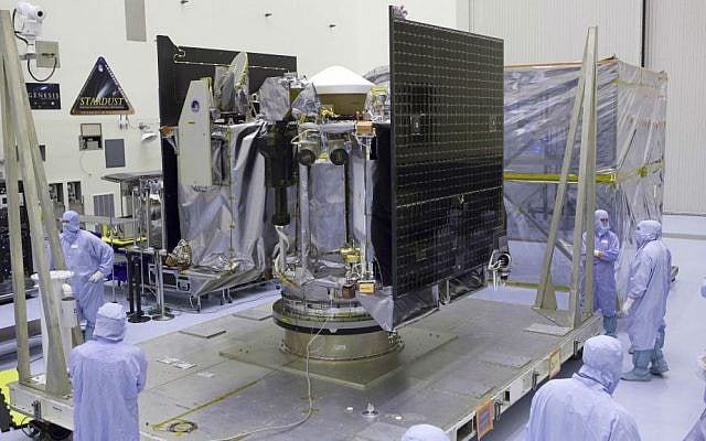 This May 21, 2016 photo provided by NASA shows the OSIRIS-REx spacecraft inside a servicing facility at Kennedy Space Center in Florida after arriving from Lockheed Martin's facility near Denver, Colorado. (Dimitri Gerondidakis/NASA via AP) This May 21, 2016 photo provided by NASA shows the OSIRIS-REx spacecraft inside a servicing facility at Kennedy Space Center in Florida after arriving from Lockheed Martin's facility near Denver, Colorado. (Dimitri Gerondidakis/NASA via AP)
