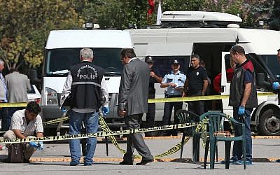 Illustrative: Police officers examine the scene outside the Israeli embassy in Ankara, Turkey where an attacker was shot and wounded, September 21, 2016. (AP Photo/Burhan Ozbilici)