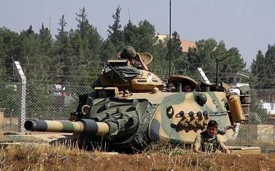 A Turkish army tank stationed near the Syrian border, in Suruc, Turkey, Saturday, Sept. 3, 2016. (AP Photo)
