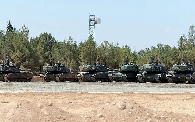 Turkish tanks stationed near the Syrian border, in Karkamis, Turkey, September 3, 2016. (Ismail Coskun, IHA via AP)