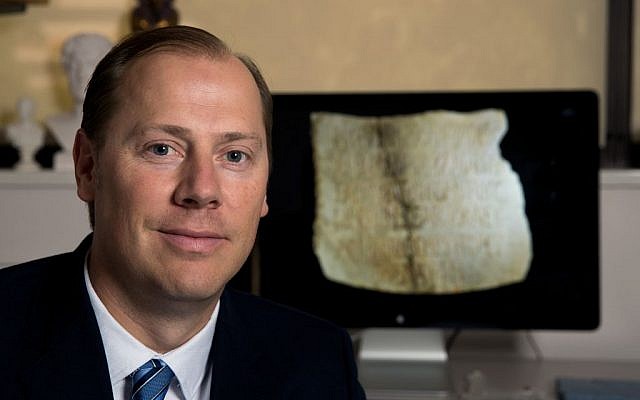 Associate professor Lincoln H. Blumell from Brigham Young University with the epitaph he translated (Jaren Wilkey/BYU Photo)