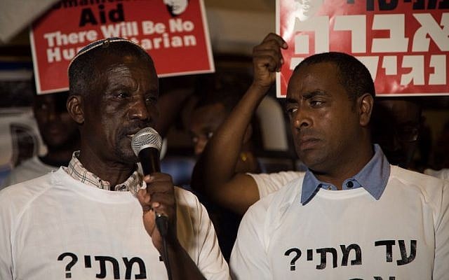 Avraham Abera Mengistu's father, Ayaline, speaks at a protest in front of the Prime Minister's Residence, September 11, 2016. (Luke Tress/Times of Israel)