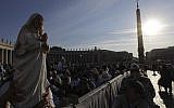 Irma Escuero, of New York, holds a statue of Mother Teresa prior to the start of a mass celebrated by Pope Francis where will be canonized in St. Peter's Square, at the Vatican, on September 4, 2016. (Gregorio Borgia/AP Photo)
