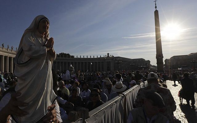 Irma Escuero, of New York, holds a statue of Mother Teresa prior to the start of a mass celebrated by Pope Francis where will be canonized in St. Peter's Square, at the Vatican, on September 4, 2016. (Gregorio Borgia/AP Photo) Irma Escuero, of New York, holds a statue of Mother Teresa prior to the start of a mass celebrated by Pope Francis where will be canonized in St. Peter's Square, at the Vatican, on September 4, 2016. (Gregorio Borgia/AP Photo)