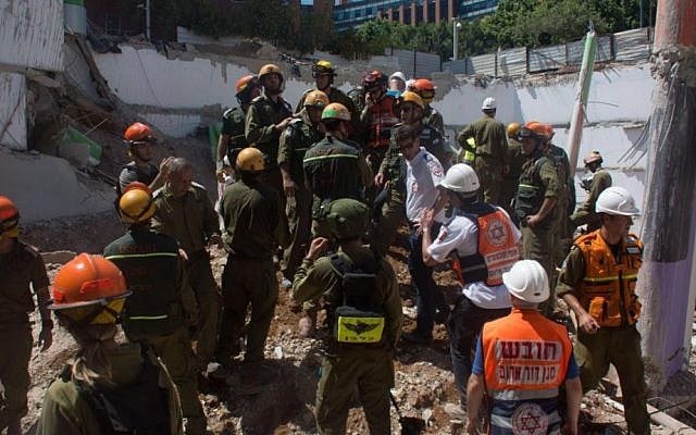 Members of the IDF Home Front Command attempt to locate and rescue people trapped underneath the rubble of a parking garage that collapsed in northeastern Tel Aviv on September 5, 2016. (IDF Spokesperson’s Unit) Members of the IDF Home Front Command attempt to locate and rescue people trapped underneath the rubble of a parking garage that collapsed in northeastern Tel Aviv on September 5, 2016. (IDF Spokesperson’s Unit)