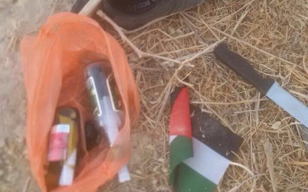 Firebombs, a knife and flag found on a Palestinian boy suspected of planning an attack in the West Bank on September 18, 2016. (Police)