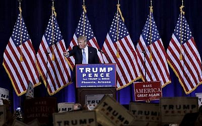 Republican presidential candidate Donald Trump points to the audience after delivering an immigration policy speech during a campaign rally at the Phoenix Convention Center, Wednesday, August 31, 2016. (AP Photo/Matt York)